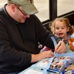 Daddy, make sure you spell our name right so we can win the Chanukah Raffle! (Choopla 2012)