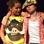 Samantha G. and Kacie S. play the Lion King's Timon and Pumba in an original show at Camp J's theater camp in 2012.